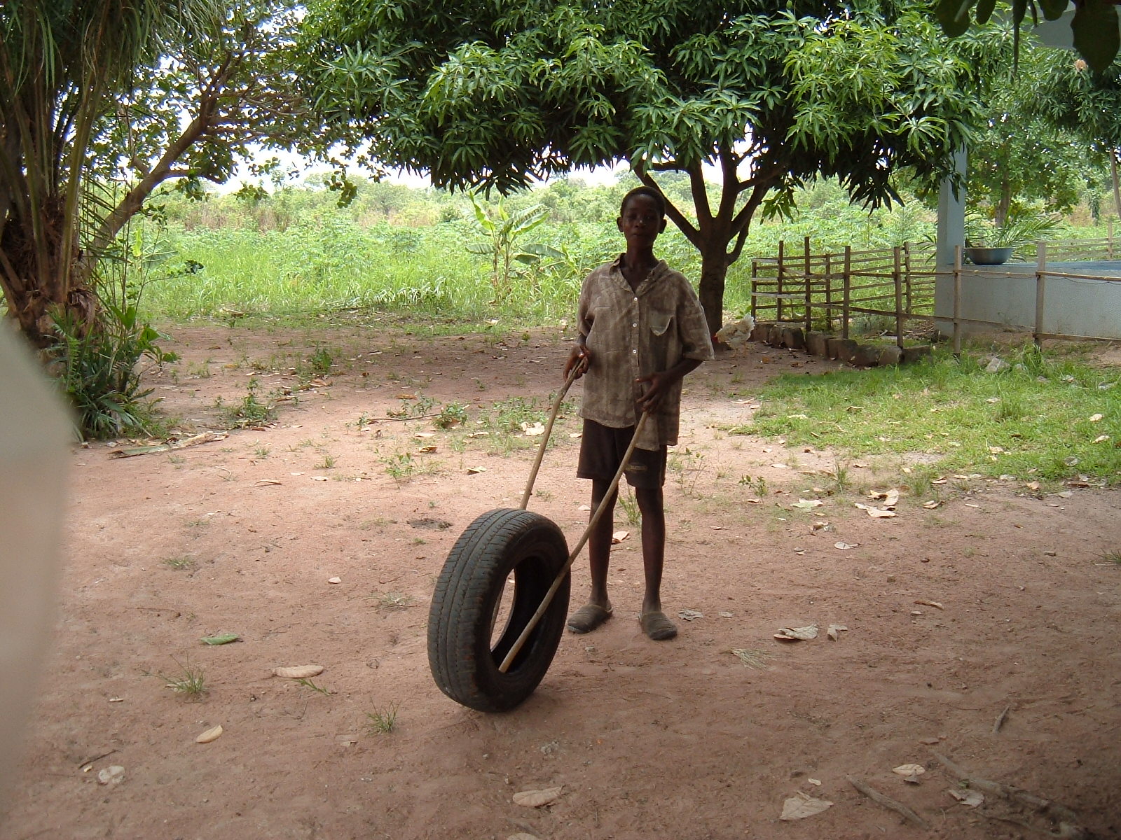 [Boy+Playing+with+Tire.jpg]