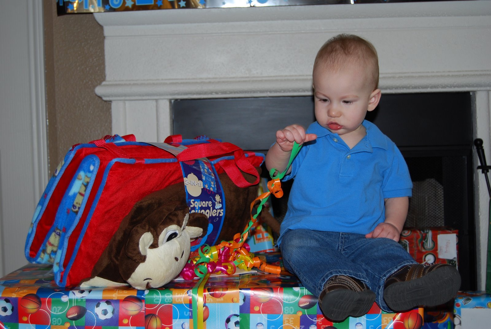 [Sitting+on+gifts+playing+with+bow.jpg]