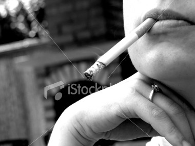 [ist2_265831_woman_smoking_a_cigarette.jpg]