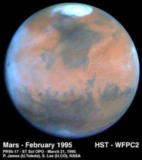 polar ice caps on Mars as seen by the Hubble`s Telescope