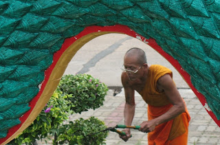 Monk working at Karon Temple