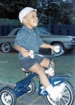 [obama___child_on_bike.jpg]