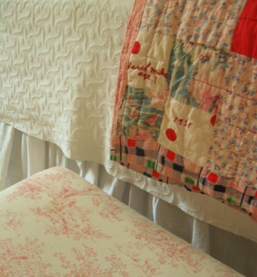 [sara-miles-age-7-handmade-quilt-at-foot-of-bed-with-toile.jpg]