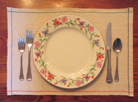 Place setting on one of the placemats.