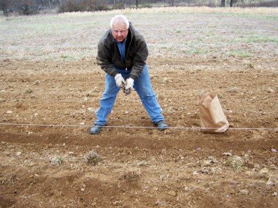 [Jim+planting+potatoes.jpg]