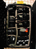 a bag full of camera equipment