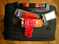 a suitcase with luggage tags and a tag