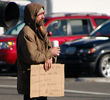 [8homeless_with_sign.jpg]