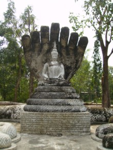 Tavalai - The Buddha meditating and guarded by seven-headed Naga.