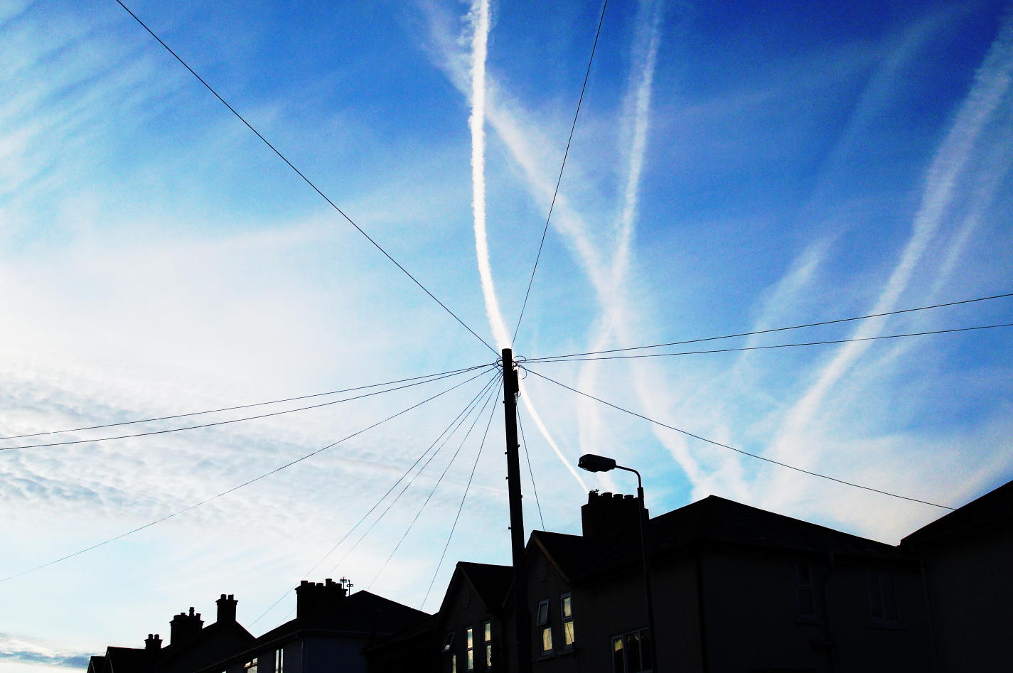Vapour trails in sky over Belfast