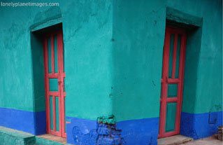 [Brightly-Painted-Corner-House-in-Chinique-Quiche-Guatemala-Photographic-Print-C12578404.jpg]