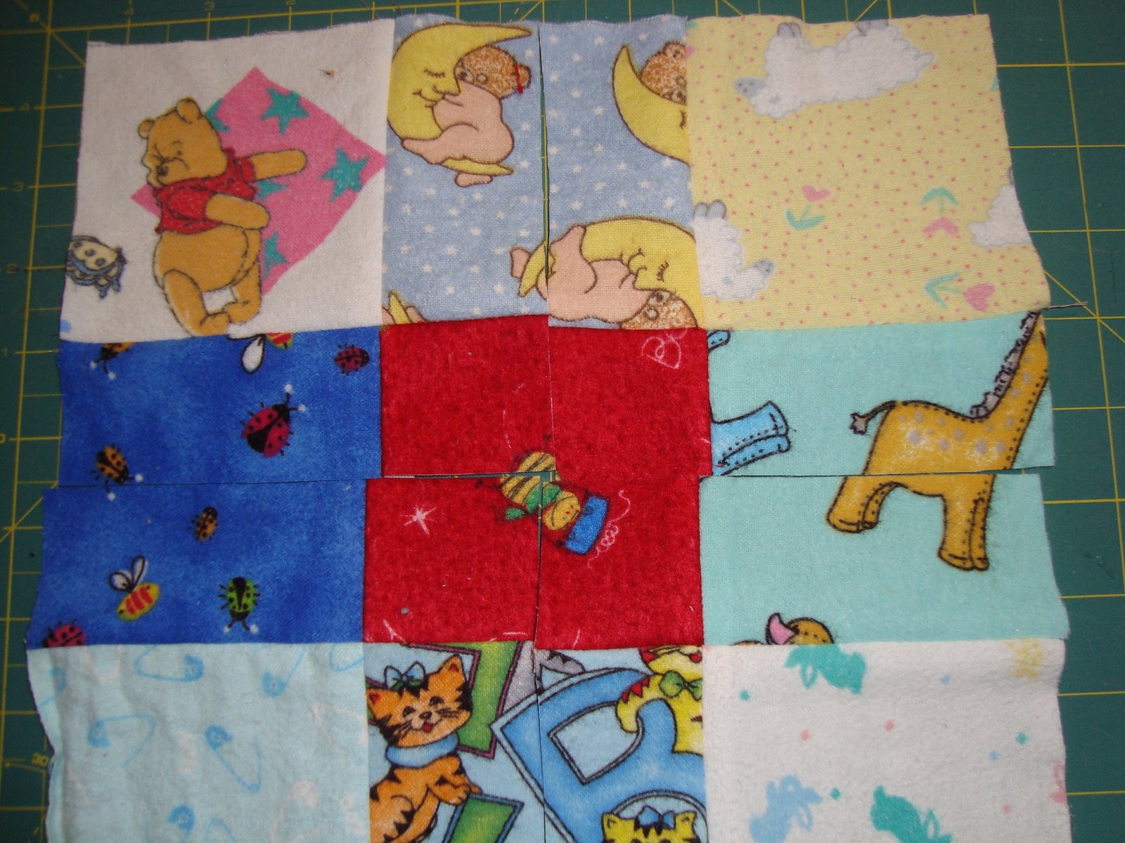 [baby+quilt+squares+cut.JPG]