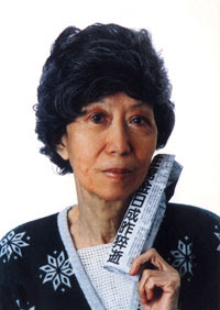 74 years old Eileen Chang was holding a newspaper which was reporting the death of Kim Il-sung