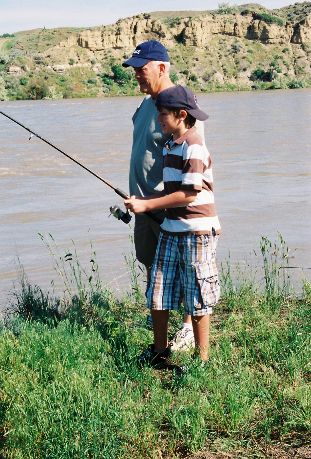 [connor+and+dad+fishing.jpg]