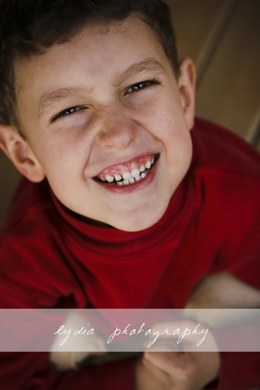 Little boy smiling and making a face at lifestyle kids portraits at Grass Valley, California
