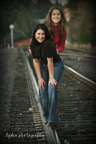 Sisters on the railroad track at lifestyle sister portraits in Colfax, California