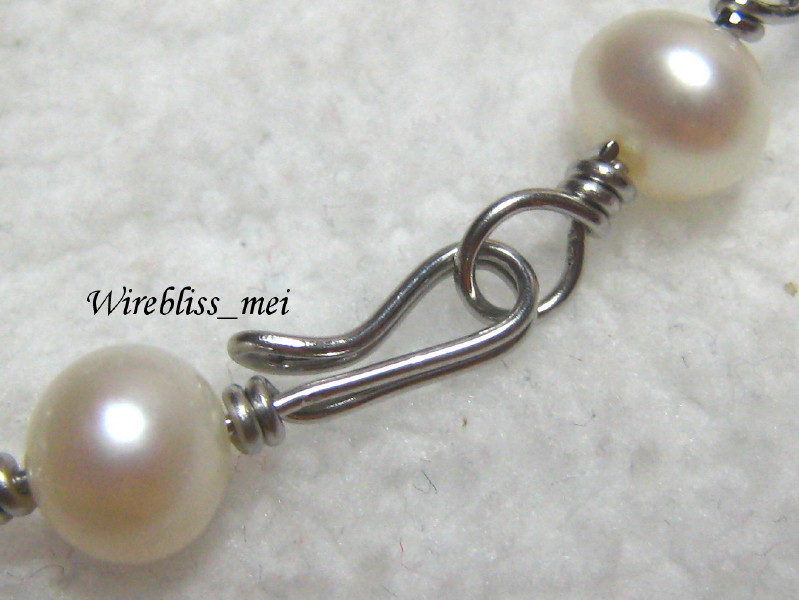 Close up of wire wrapped clasp with pearl