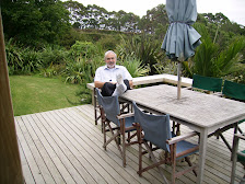 Manford relaxing on our deck in Macademia heaven