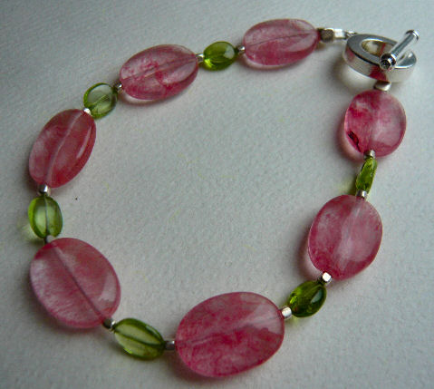 [watermelon-+strawberry+quartz,+silver,+and+peridot+bracelet.jpg]