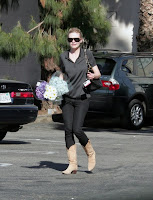 Kirsten Dunst picking up flowers in LA