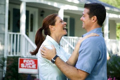 [happy_couple_outside_sold_home.jpg]