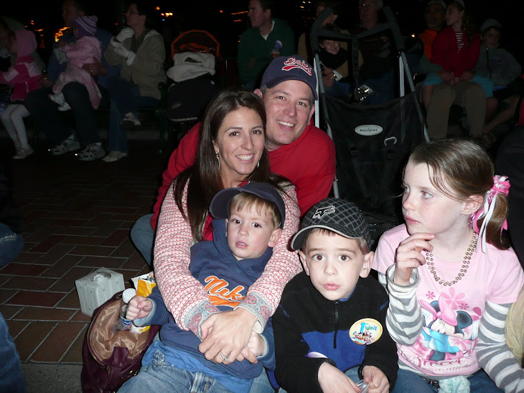 Family Photo at Disneyland watching the parade