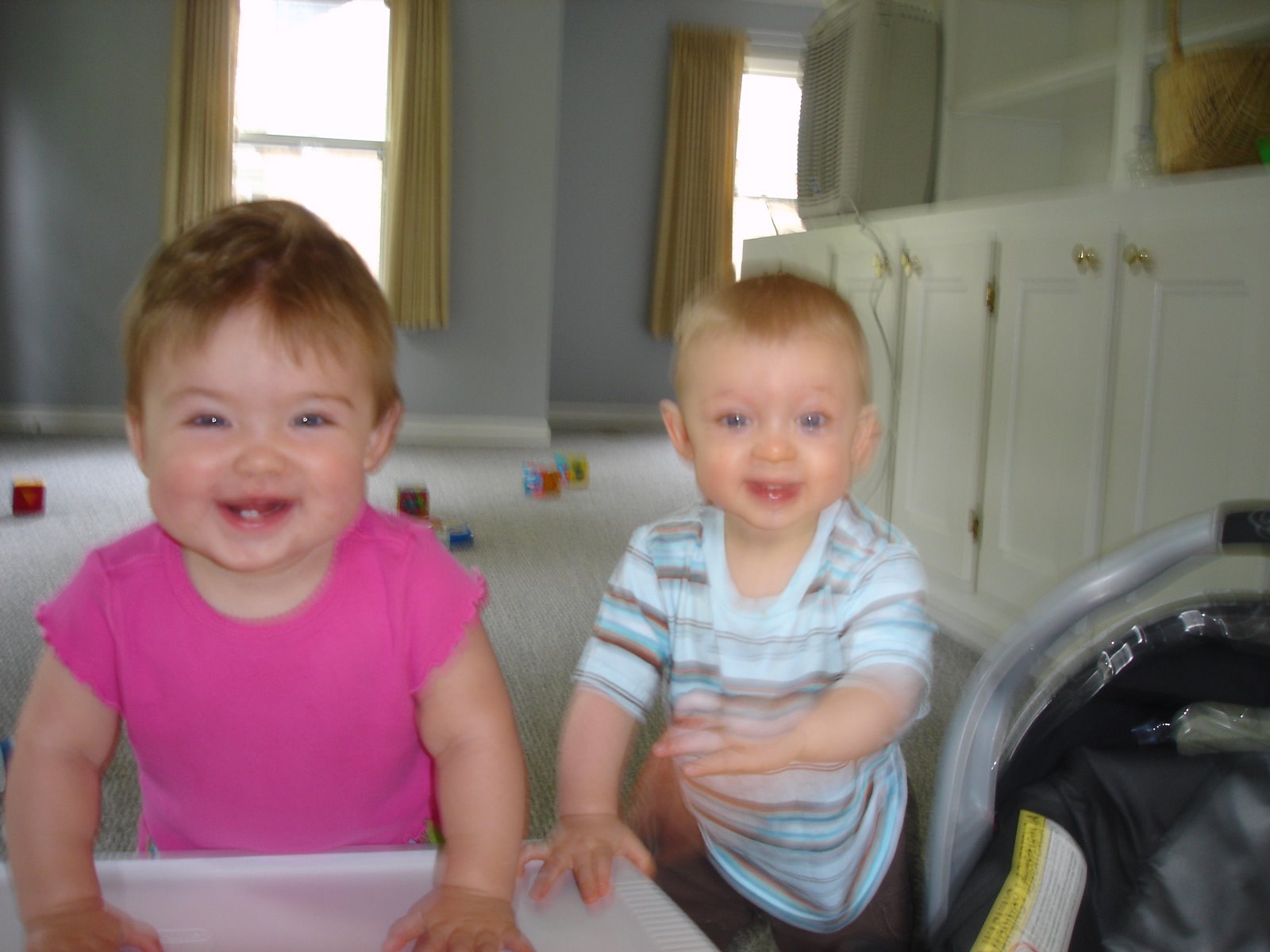 [twins+are+happy+to+be+in+new+home.JPG]