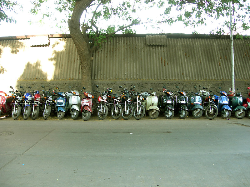 parked scooters at andheri station
