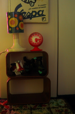Modern dolls' house miniature stacking shelf units with mod lamps and clock on top.