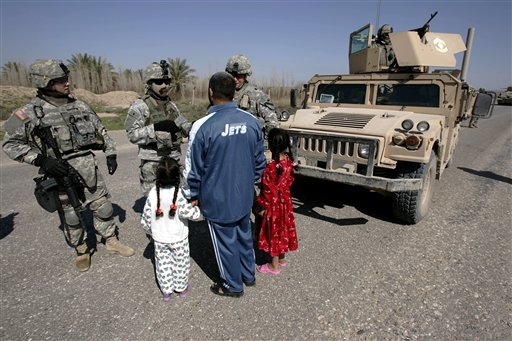 [IrAQ.Soldiers+of+the+6-9+squadron,+3rd+brigade,+1st+Cavalry+Division,+talk+to+an+Iraqi+man.jpg]