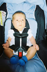 Maddox hanging out in his carseat.