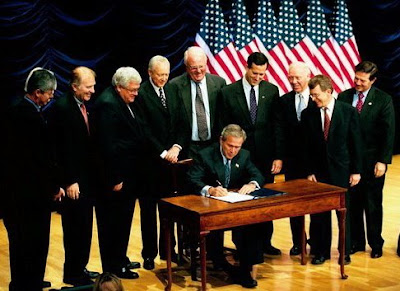 Bush signs anti-abortion law November 5, 2003. photo White House.