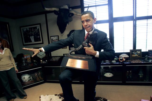 Senator Obama Striking the Heisman Pose with Earl Campbell's 1977 Heisman Trophy
