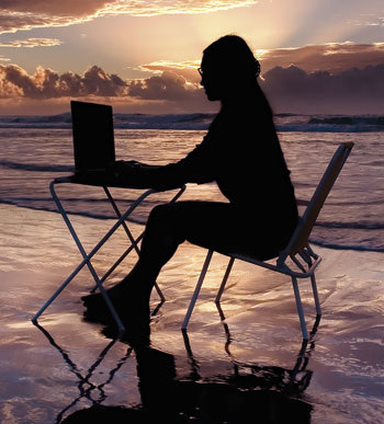 [woman-on-beach-with-laptop.jpg]