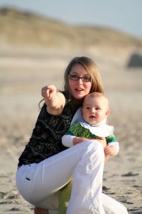 [836410_woman_and_baby_on_the_beach_2.jpg]