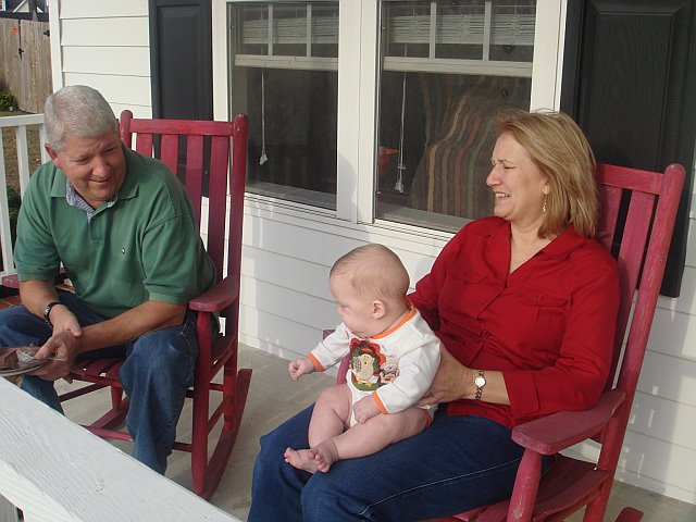 [Dad+and+Mom+G+with+Gage+on+porch.jpg]