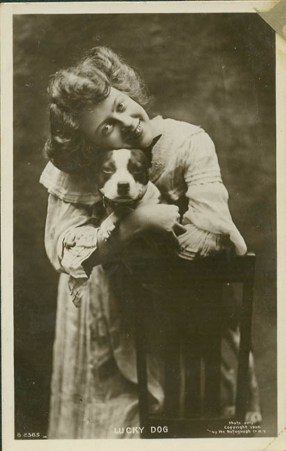 [girl+holding+dog.jpg]