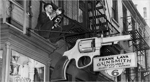 [Weegee+on+the+fire+escape+in+front+of+his+stydio+on+Centre+Market+Place+ab.+1939+Photographer+unidentified.jpg]