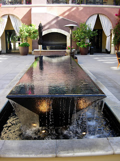 a water fountain in a courtyard
