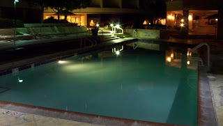 a pool at night with lights