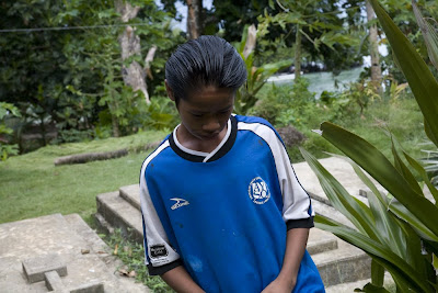 Boy wearing blue soccer jersey