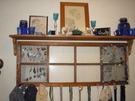 [old+screen+door+window+insert+turned+into+jewerly+hat+holder+with+shelf+above.JPG]