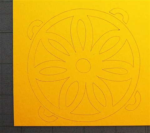 [yellow+flower+in+circle+on+mat.jpg]
