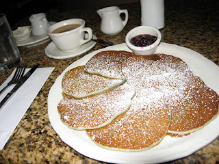 Blueberry pancakes with blueberry compote and coffee
