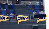 The 2003 division pennant is unfurled at Turner Field on Sept. 19.
