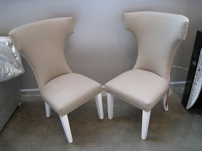 Two high backchairs with nail head trim and a cross detail on the back from Shine Home