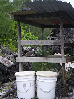 an outdoor permaculture toilet; two buckets. 