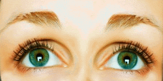picture of a caucasion woman's big, green eyes and nicely trimmed eyebrows