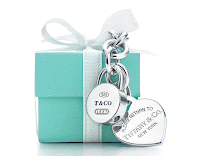 picture of little blue Tiffany box with two silver Tiffany charms